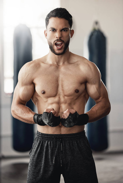 Boxing, strong and boxer man portrait in training workout or fitness gym. Muscle strength, body goals and determined personal trainer athlete during his exercise for healthy motivation or mma sports. - 写真・画像