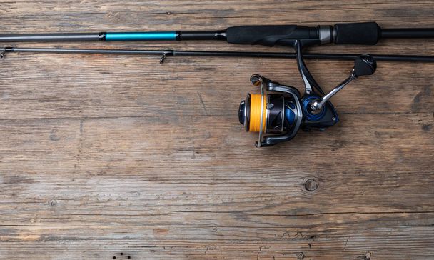 Fishing tackle on wooden background - Foto, Imagen