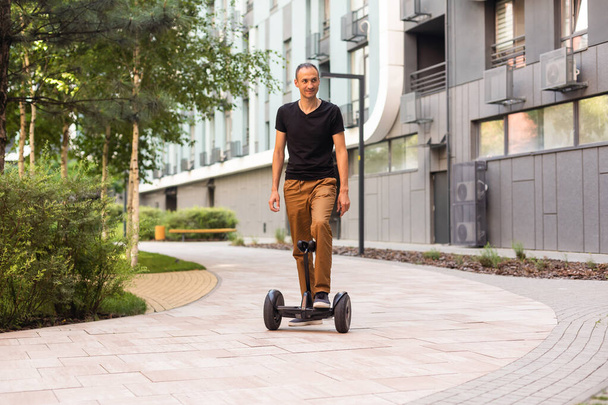 man stand near segway hoverboard. - Photo, image