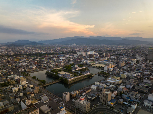 Aerial view of Imabari Castle and city landscape at dawn. High quality photo - Photo, Image