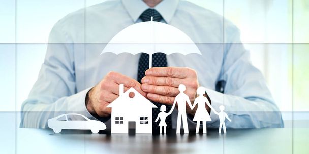 General agent protecting a family, a house and a car with his hands, geometric pattern - Photo, Image