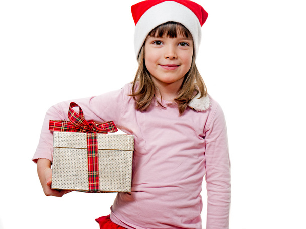 Дитина з hat Дід Мороз тримає подарунок - Фото, зображення