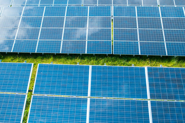 Solar panels in the green field for generation of green energy safety for environmental  - Foto, Imagen