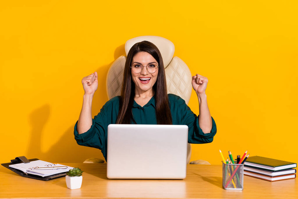 Photo of young excited woman celebrate luck achievement fists hands triumph isolated over yellow color background. - Фото, изображение