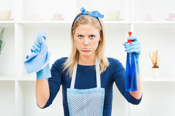 Housewife is sad because she has to clean - Foto, afbeelding