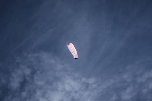 Paraglider soaring in the blue sky - Photo, Image