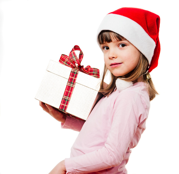 Child with Santa Claus hat holding Christmas Present - Фото, изображение