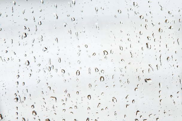 візерунок дощових крапель у вікні під сильним дощем
 - Фото, зображення