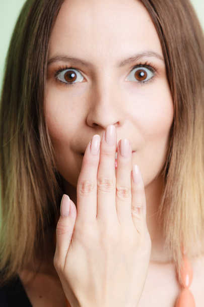 Surprised woman face covering her mouth with hand - Fotoğraf, Görsel