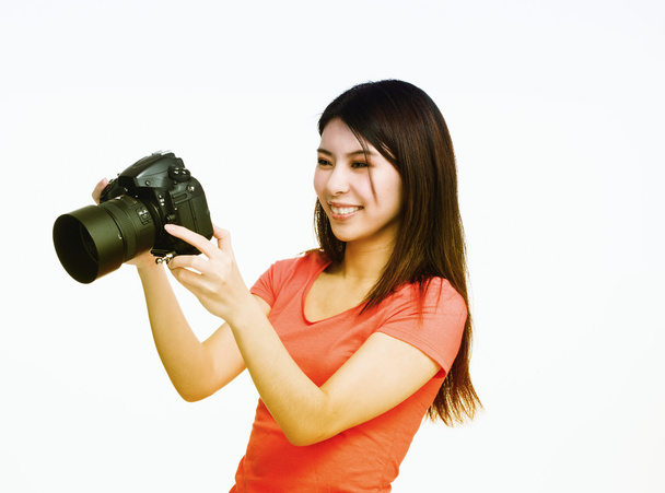 Ázsiai fotós boldog látszó-on fényképezőgép képek - Fotó, kép
