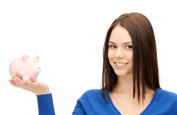 Lovely woman with piggy bank - Foto, imagen