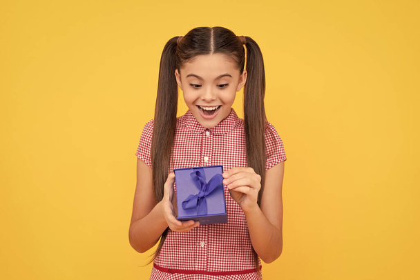 happy birthday. surprise for her. valentines day. boxing day. shopping sale and discount present for womens day. teen girl holding giftbox. child prepare for holidays. amazed kid with gift box. - Foto, Imagem