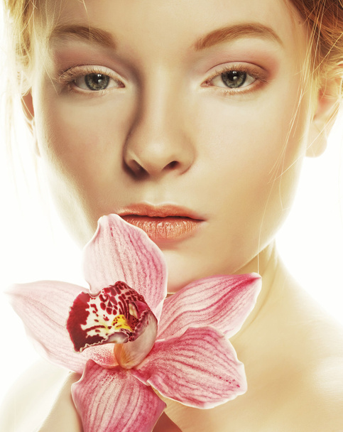 beautiful woman with pink flower - Фото, зображення