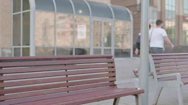 Casual Man Coming, Sitting on Bench and Opening Laptop - Fotó, kép