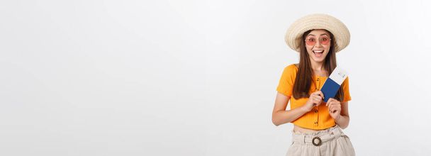 Portrait of happy tourist woman holding passport on holiday on white background - Photo, Image