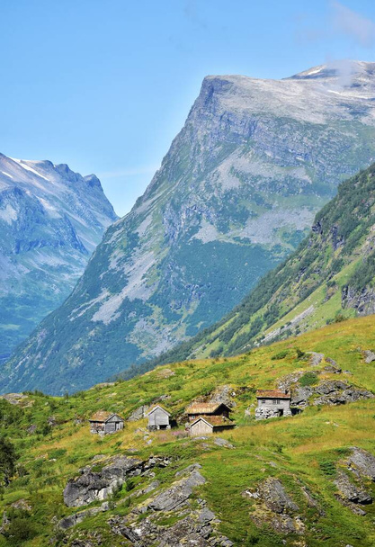 Tiny huts at pasture in mountains, natural background. - Valokuva, kuva