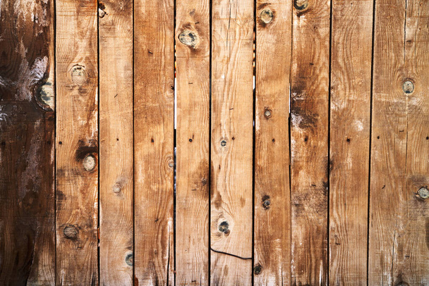 Texture of a fence made of untreated weathered boards. High quality photo - Foto, afbeelding