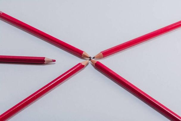 Red wooden pencils isolated on white background. close up - 写真・画像
