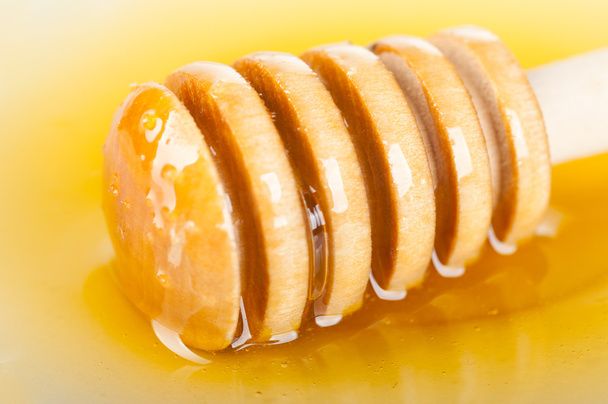 Honey spoon - Фото, изображение