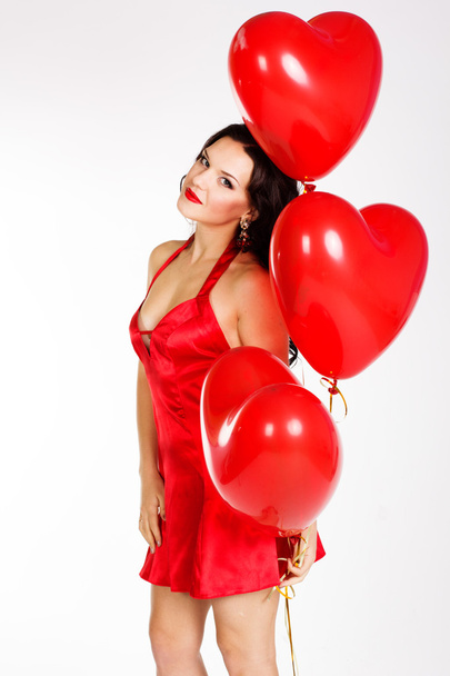 Sexy brunette with balloons heart - Foto, imagen