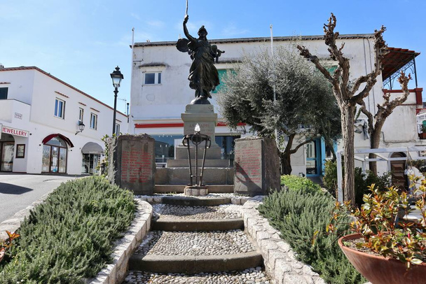 Anacapri, Campania, Italy - March 12, 2022: Monument to the Fallen made by sculptor Arnaldo Zocchi in bronze in Piazza della Vittoria - Photo, Image