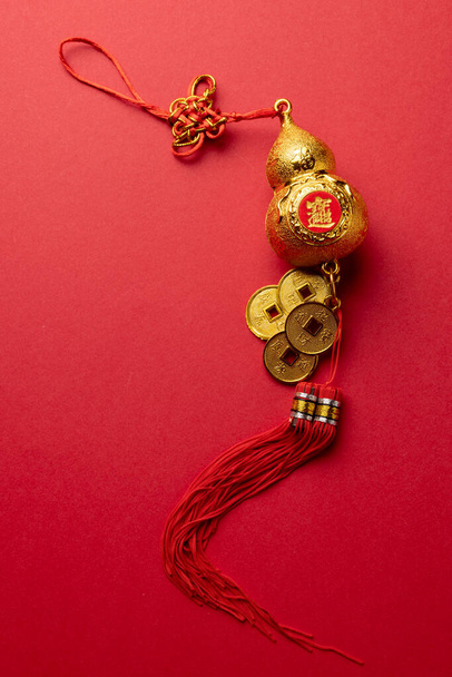 Composition of traditional chinese decoration on red background. Chinese new year, tradition and celebration concept. - Φωτογραφία, εικόνα