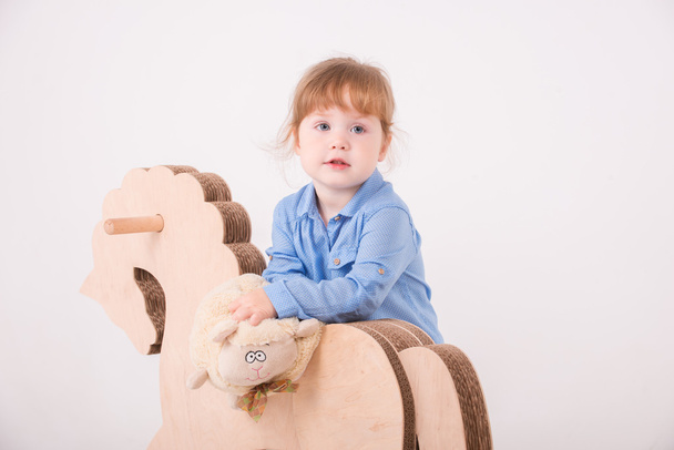 Child with the toy horse - Photo, Image