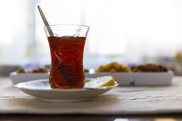 Azerbaijani tea with lemon and set nuts and sweets - Photo, Image