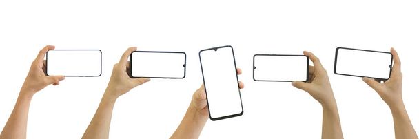 Verzameling van mannelijke handen houden mobiele smartphone met blanco wit scherm geïsoleerd op witte achtergrond omvatten knippen pad. - Foto, afbeelding