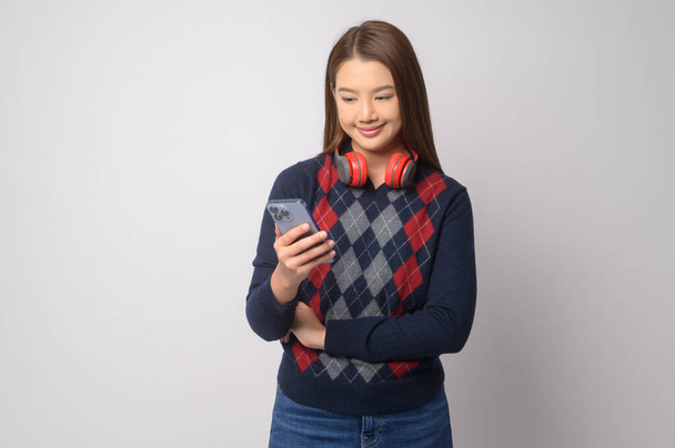 A Young asian woman using smartphone over white background, technology concept. 		 - Fotoğraf, Görsel