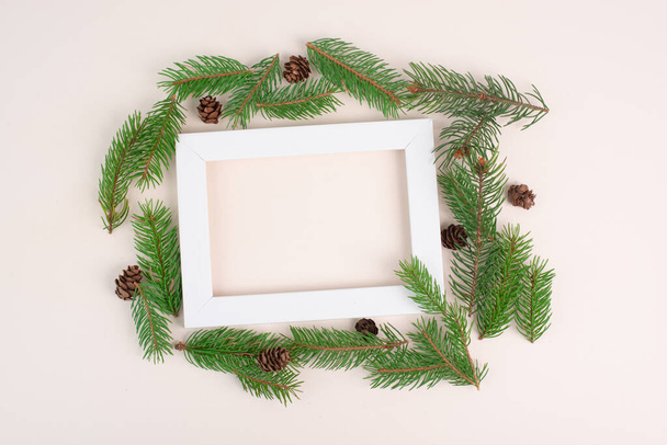 Christmas holiday background, frame with fir branches and cones, winter season greeting card with copy space - Photo, Image