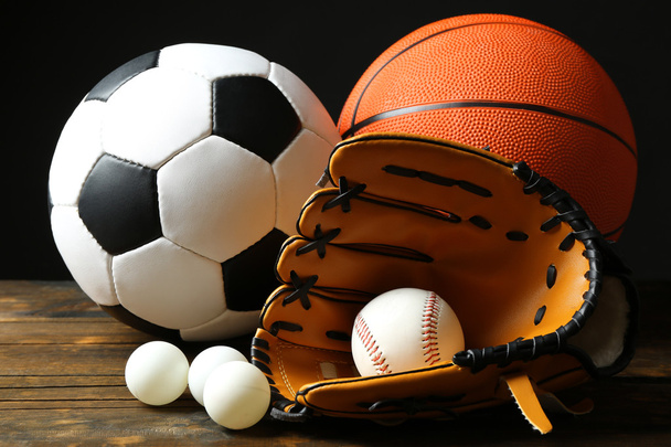 Sports balls on black background - Foto, imagen