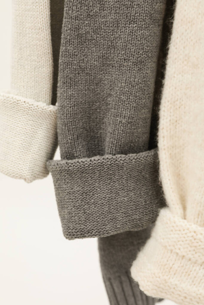 Hanging sweaters, concept of autumn season clothes - Valokuva, kuva