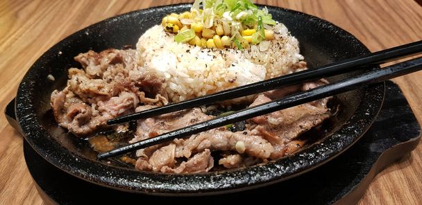 selective focus grilled beef steak with korean sauce bulgogi on top of rice with slice of pepper and sweet corn - korean food style - Photo, Image