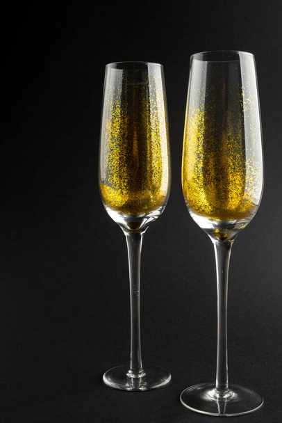 Composition of close up of new years champagne on black background. New year's eve party, celebration and copy space concept. - Fotografie, Obrázek