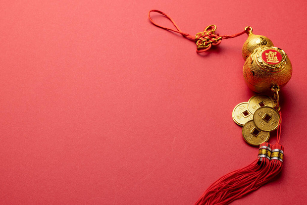 Composition of traditional chinese decoration on red background. Chinese new year, tradition and celebration concept. - Foto, Imagem