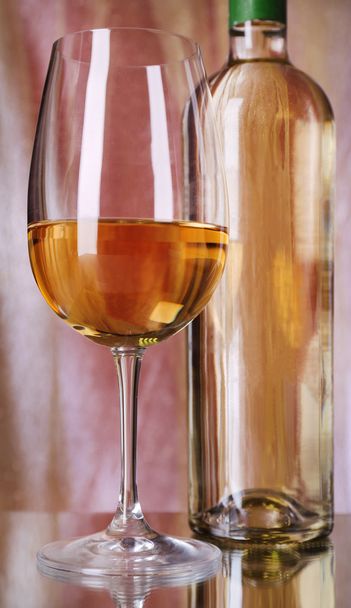 Wine bottle and wineglass - Фото, изображение
