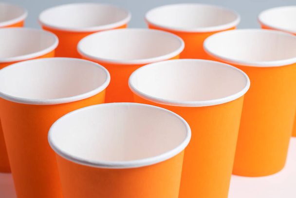 large group of orange disposable paper cups. - Photo, Image