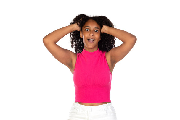 Surprised teenager girl wearing pink t-shirt isolated on a white background - Φωτογραφία, εικόνα