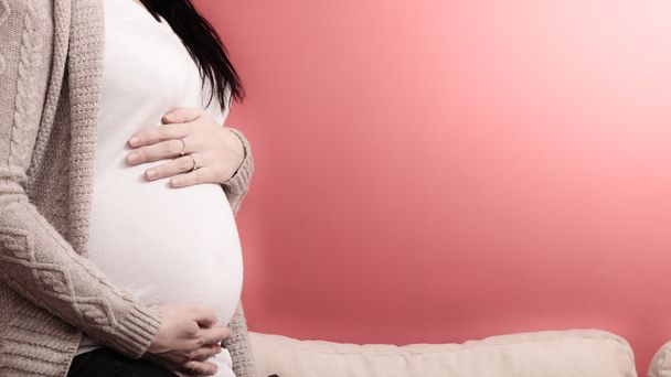 Closeup on tummy of pregnant woman - Photo, Image