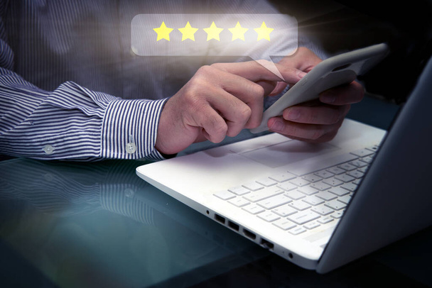 customer service star review via computer - Photo, Image