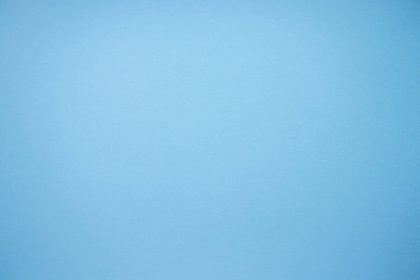 Simple blue background with paper texture. - Foto, imagen