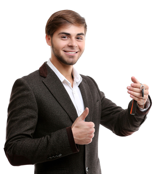 Businessman holding car key isolated on white - Photo, image