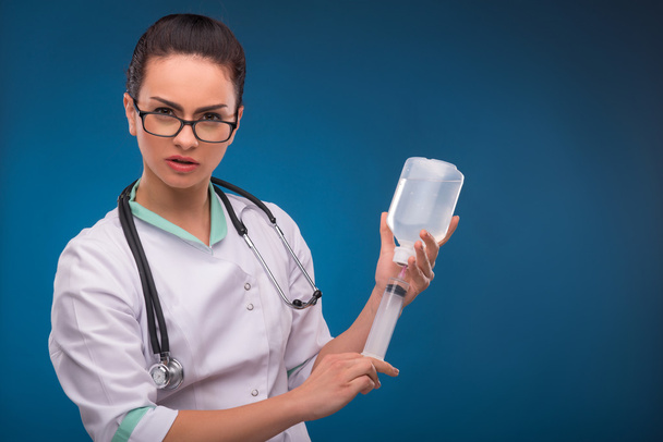 Woman doctor with dropper - 写真・画像