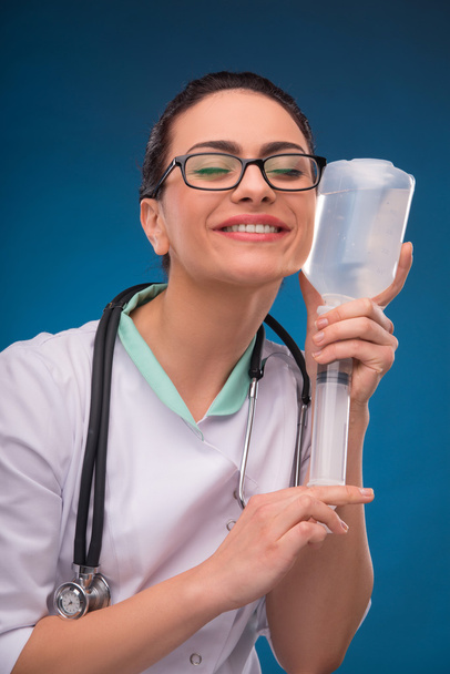 Woman doctor with dropper - 写真・画像