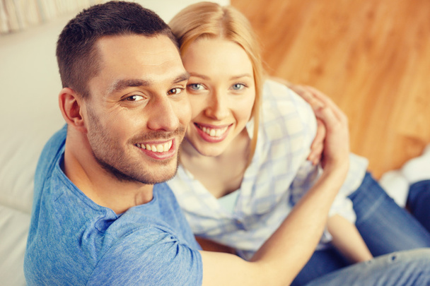 smiling happy couple at home - Foto, imagen