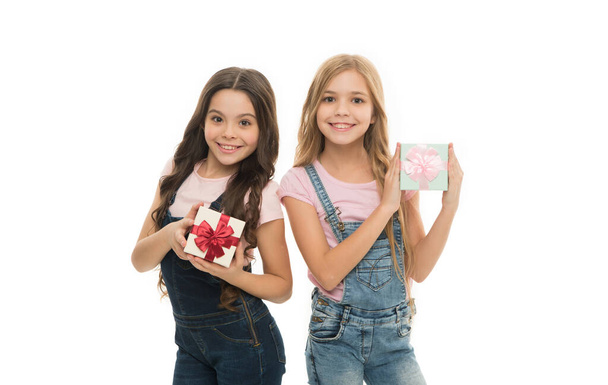 Delivering gifts for children. Adorable kids with beautifully wrapped birthday gifts. Happy little girls holding gifts in hands. Small children with gifts on boxing day. - Zdjęcie, obraz