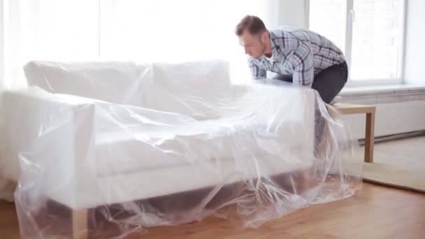 male decorating new home - Materiał filmowy, wideo
