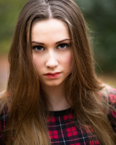 Portrait of a Beautiful Dark Blond Teenage Girl in a Forest - Foto, afbeelding