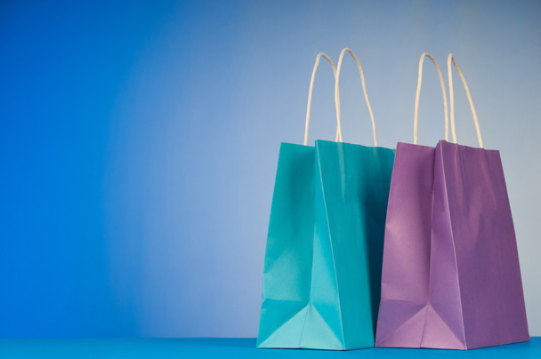 Shopping bags against gradient background - Photo, Image